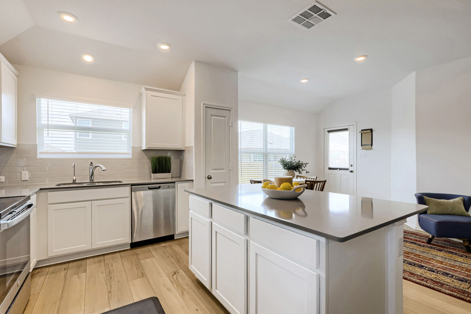 Bright kitchen with island at 452 Perfect World Loop