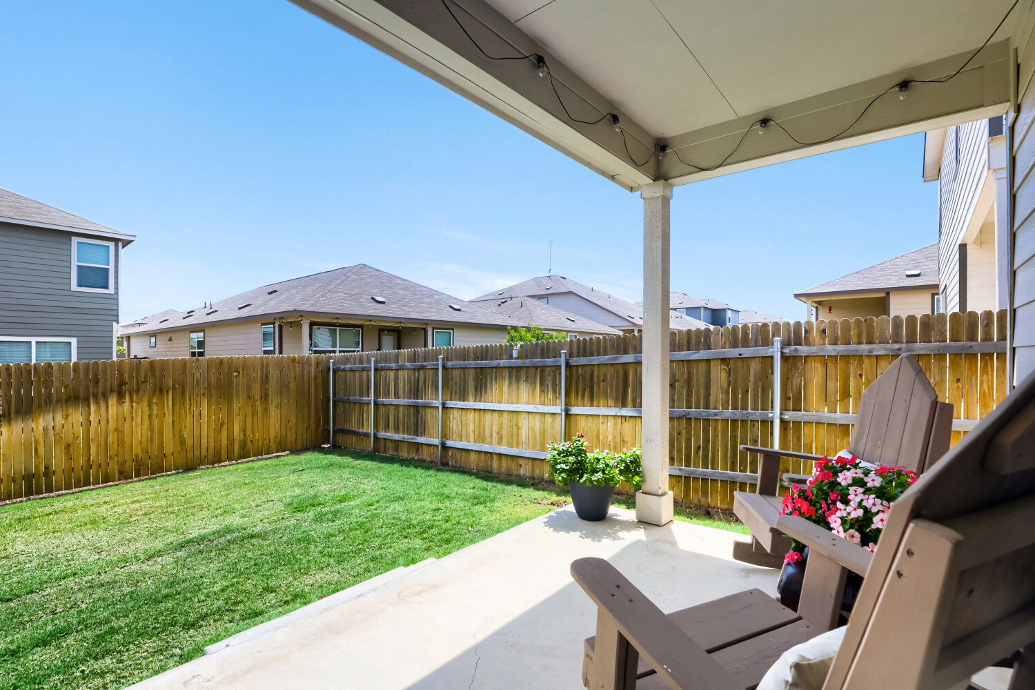 Covered rear patio and fenced yard