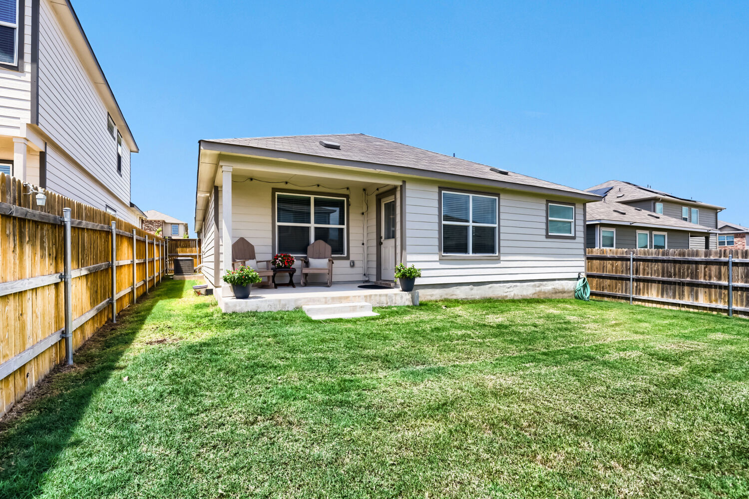 Fenced backyard and rear exterior